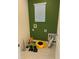 Functional laundry room with a window, hookups, and storage area at 6783 Grace Hammock Rd, Harmony, FL 34773