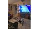 Comfortable living room with modern fireplace, TV, and neutral tile flooring at 7511 Us Highway 98 N, Lakeland, FL 33809