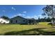 The backyard has a cozy patio and plenty of green space at 804 Wildwood Cir, Port Orange, FL 32127
