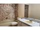 Bathroom with marble countertop vanity and bath tub with shower head at 804 Wildwood Cir, Port Orange, FL 32127