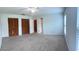Spacious bedroom boasts two large closets, new carpet, neutral paint, and ample natural light at 804 Wildwood Cir, Port Orange, FL 32127