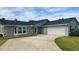 Beautiful single-story home featuring a two-car garage and neutral paint scheme at 804 Wildwood Cir, Port Orange, FL 32127