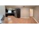 Modern kitchen features stainless steel appliances, dark cabinetry, tile backsplash, and tile flooring at 804 Wildwood Cir, Port Orange, FL 32127