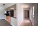 Open concept kitchen with stainless steel appliances and a breakfast bar leading into the entryway at 804 Wildwood Cir, Port Orange, FL 32127