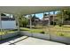 Patio overlooking a large, fenced in backyard with mature landscaping at 804 Wildwood Cir, Port Orange, FL 32127