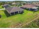 Aerial view of the home showing the roof, backyard, and screened in porch at 819 San Raphael St, Kissimmee, FL 34759