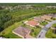 Expansive aerial view of the community showcasing lush landscaping and serene water features and well maintained lawns at 819 San Raphael St, Kissimmee, FL 34759