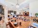 Elegant dining room with wooden table setting, decorative lighting, and an open layout into the kitchen and living spaces at 819 San Raphael St, Kissimmee, FL 34759