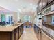 Beautiful open kitchen with a large island, dark wood cabinets, and stainless steel appliances at 819 San Raphael St, Kissimmee, FL 34759