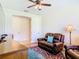 Comfortable living room featuring leather furniture, wood floors, and ample natural light at 819 San Raphael St, Kissimmee, FL 34759