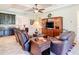 Stylish living room featuring a large entertainment center and comfortable seating arrangements at 819 San Raphael St, Kissimmee, FL 34759