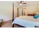 Large main bedroom features a four-poster bed and wood-look floors at 819 San Raphael St, Kissimmee, FL 34759