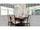 Bright dining room with a modern table setting and stylish window treatments, perfect for Gathering meals at 9038 Pelican Cove Trce, Kissimmee, FL 34747