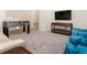 Relaxing game room featuring plush seating, television, and a foosball table for entertainment at 9038 Pelican Cove Trce, Kissimmee, FL 34747