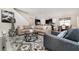 Spacious living room with stylish furniture and decor, seamlessly connected to the kitchen and dining area at 9038 Pelican Cove Trce, Kissimmee, FL 34747