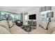 Inviting living room with comfortable seating, a large TV, and sliding glass doors to outdoor space at 9038 Pelican Cove Trce, Kissimmee, FL 34747