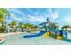 Enjoy the kid-friendly water park with slides, palm trees, and cabanas in the community at 9038 Pelican Cove Trce, Kissimmee, FL 34747