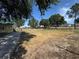 Expansive backyard with a view of the home and plenty of space for outdoor activities at 98 Orange Park Blvd, Lake Wales, FL 33898
