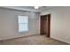 Neutral bedroom with a window and closet, ready for your personal touch at 804 Wildwood Cir, Port Orange, FL 32127