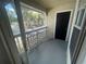 Enjoy the view from this private screened balcony that features lattice and tan wood at 1027 S Hiawassee Rd # 2323, Orlando, FL 32835