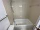 Standard bathroom featuring tile flooring, shower and tub combo with neutral accents at 1027 S Hiawassee Rd # 2323, Orlando, FL 32835