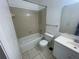 Standard bathroom featuring tile flooring, shower and tub combo, and a vanity at 1027 S Hiawassee Rd # 2323, Orlando, FL 32835