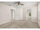 Neutral bedroom with a ceiling fan and grey carpet at 11843 Fiction Ave, Orlando, FL 32832