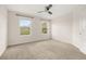 Bedroom with two windows and grey carpeting at 11843 Fiction Ave, Orlando, FL 32832