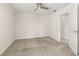 Bedroom with neutral walls, carpet floors, ceiling fan, and access to the ensuite bathroom at 11843 Fiction Ave, Orlando, FL 32832