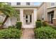 Charming front entrance with a brick pathway and manicured landscaping enhancing curb appeal at 11843 Fiction Ave, Orlando, FL 32832
