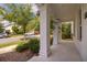 Inviting front porch with classic columns and a view of the well-maintained neighborhood street at 11843 Fiction Ave, Orlando, FL 32832