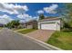Paver driveway leading to a two-car garage at 11843 Fiction Ave, Orlando, FL 32832