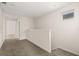 Upstairs hallway with plush carpet and access to rooms at 11843 Fiction Ave, Orlando, FL 32832