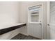 Practical laundry area with built-in countertop, door to the backyard, and ample storage at 11843 Fiction Ave, Orlando, FL 32832