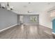 Bright, open living room with hardwood floors, a ceiling fan, and natural light at 11843 Fiction Ave, Orlando, FL 32832