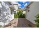 Paver patio between two buildings with privacy landscaping at 11843 Fiction Ave, Orlando, FL 32832