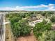 A scenic view of the townhome community surrounded by greenery and access roads at 12539 Orangewood Ct, Tavares, FL 32778