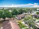 Aerial view showcasing the property and surrounding neighborhood with mature trees at 12539 Orangewood Ct, Tavares, FL 32778