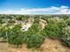 Aerial view of community featuring lush greenery and nearby conveniences at 12539 Orangewood Ct, Tavares, FL 32778