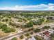 A townhome community with lush greenery, easy road access, and nearby amenities at 12539 Orangewood Ct, Tavares, FL 32778