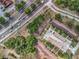 An aerial look at a townhome community showcasing parking and convenient highway access at 12539 Orangewood Ct, Tavares, FL 32778