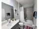 Bathroom featuring a gray vanity, toilet, and shower/tub combination at 1321 Yorkdale Rd, Davenport, FL 33837