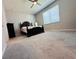 This spacious bedroom features a vaulted ceiling, carpeted floor, and a large window at 1321 Yorkdale Rd, Davenport, FL 33837