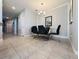Elegant dining room with modern chandelier, a glass-top table, and sleek black chairs at 1321 Yorkdale Rd, Davenport, FL 33837