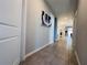 Spacious hallway with tile flooring and modern decor; great natural light at 1321 Yorkdale Rd, Davenport, FL 33837