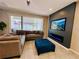 Spacious living room with large sectional sofa and a modern fireplace at 1321 Yorkdale Rd, Davenport, FL 33837