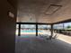 A community pool with chairs and tables, and a covered area for residents to relax at 1321 Yorkdale Rd, Davenport, FL 33837