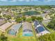 A lovely aerial view of a community featuring a lake, houses and lush landscaping at 1338 Lake Biscayne Way, Orlando, FL 32824