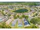 An aerial view of a beautiful community with a scenic lake and well-maintained landscaping at 1338 Lake Biscayne Way, Orlando, FL 32824