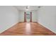 Empty bedroom with hardwood floors, neutral walls, ceiling fan, and window at 1338 Lake Biscayne Way, Orlando, FL 32824